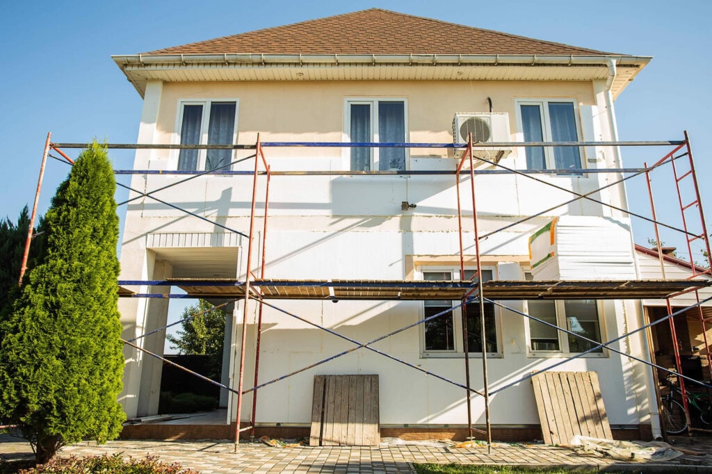 Exterior house painting with professional team